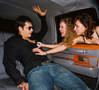 Man in a limo between two women, Arouse-Rx pheromone cologne for men, cedar and citrus