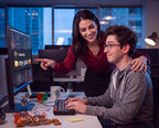 Woman leaning in to a man at the office, Arouse-Rx unscented pheromone cologne oil for men